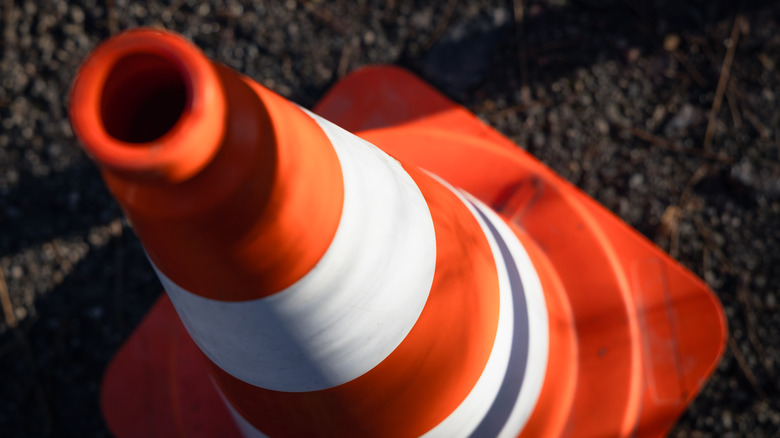 A traffic cone on pavement.