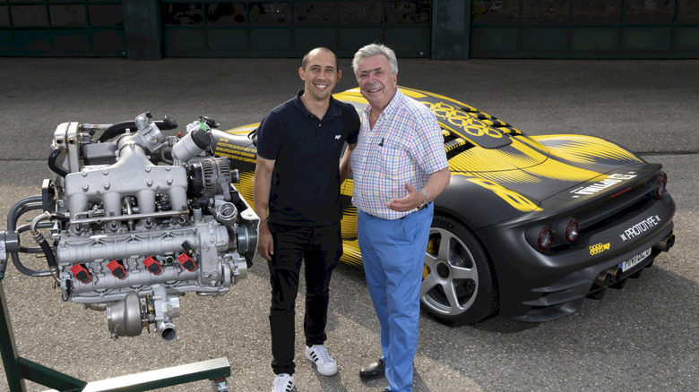 Rear 3/4 view of Ruf B8 Erprober and its engine with company founder Alois Ruf and chief engineer Marc Brunner