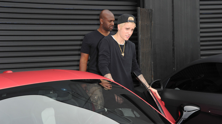 Justin Bieber getting out of Ferrari 458 Italia