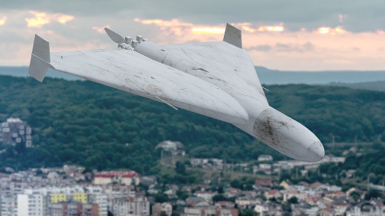 An artist's rendering of a Shahed-style UCAV flying over a city