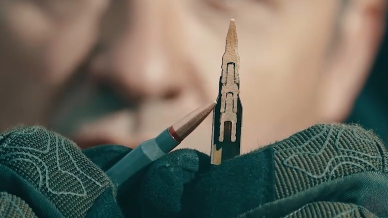 A halved Mnogotochie bullet showing its three stacked projectiles