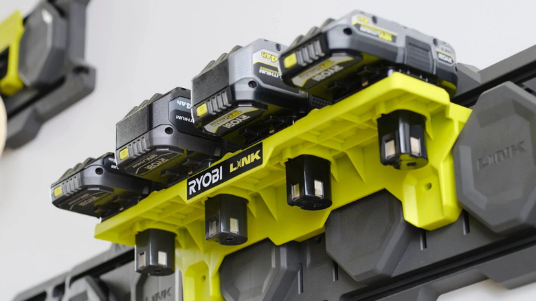 Ryobi batteries stored on Ryobi shelf