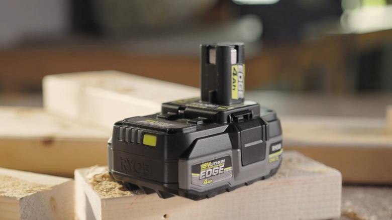 18V HP Edge battery sitting on a piece of cut wood