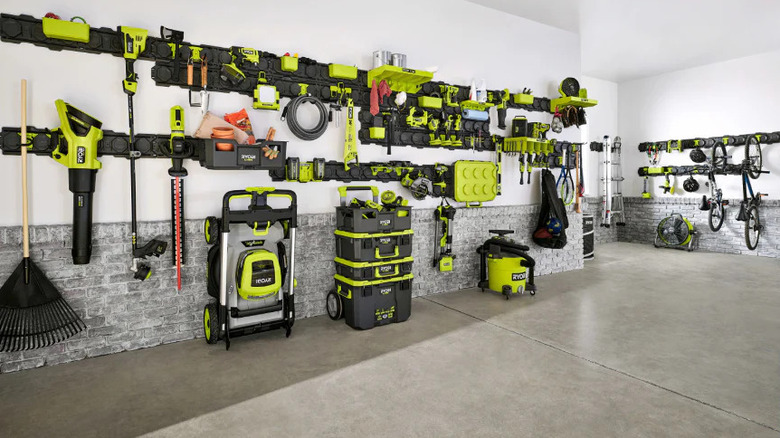 Many Ryobi tools mounted in a large garage