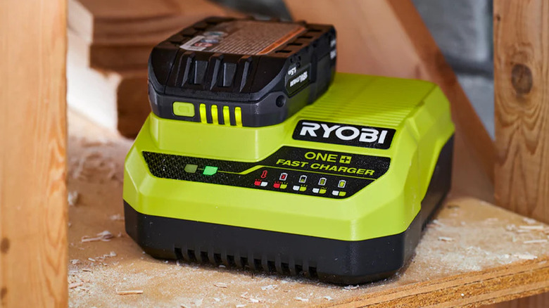 The Ryobi 18V One+ Fast Charger on some rough wood framing
