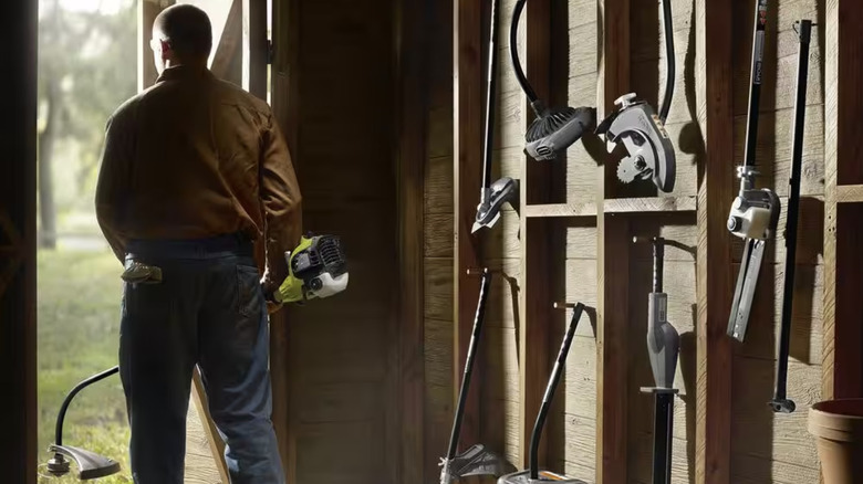 Man walking with Ryobi tool