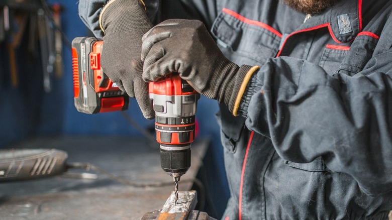 worker using power drill