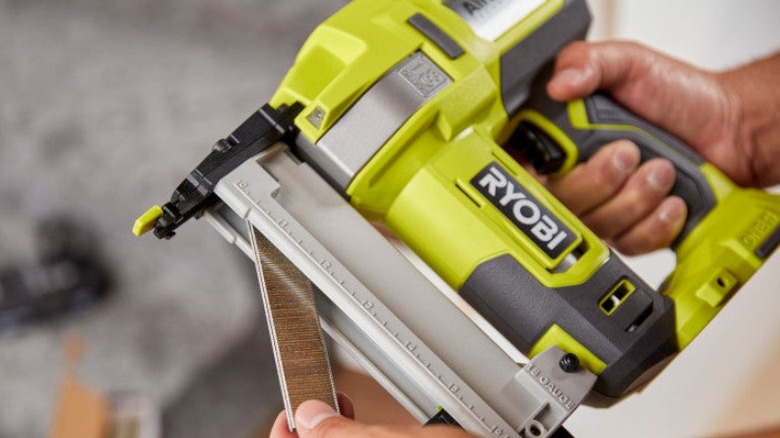 Person loading Ryobi stapler