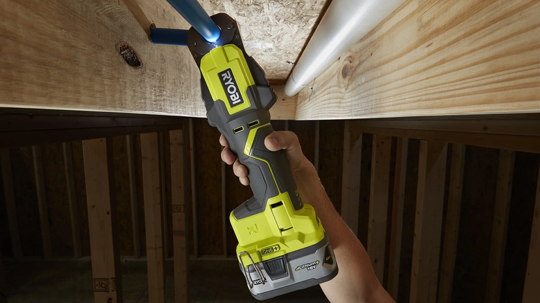 18V ONE+ PEX Crimp Ring Press Tool being used on metal pipe