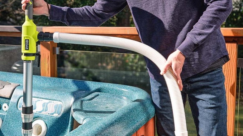 Ryobi pole pump being used in a hot tub
