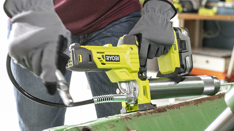 18V One+ Grease Gun in use
