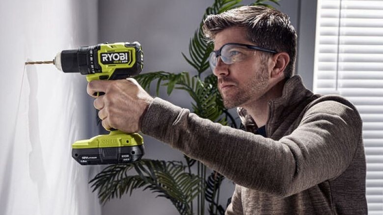 Man using a Ryobi power drill