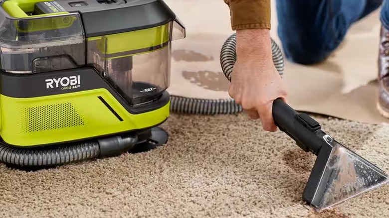 Using the Ryobi spot cleaner on a carpet