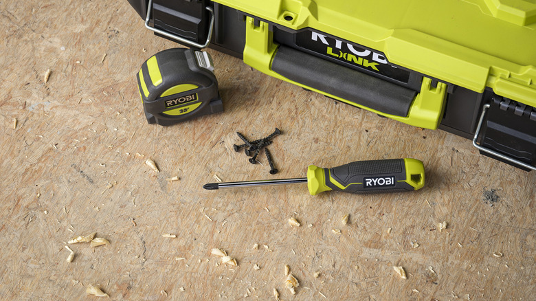 Screwdriver, screws, and tape measure