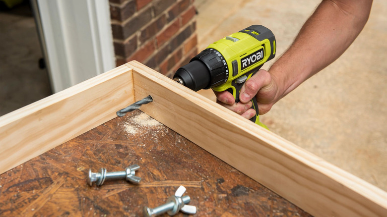 Person drilling a hole