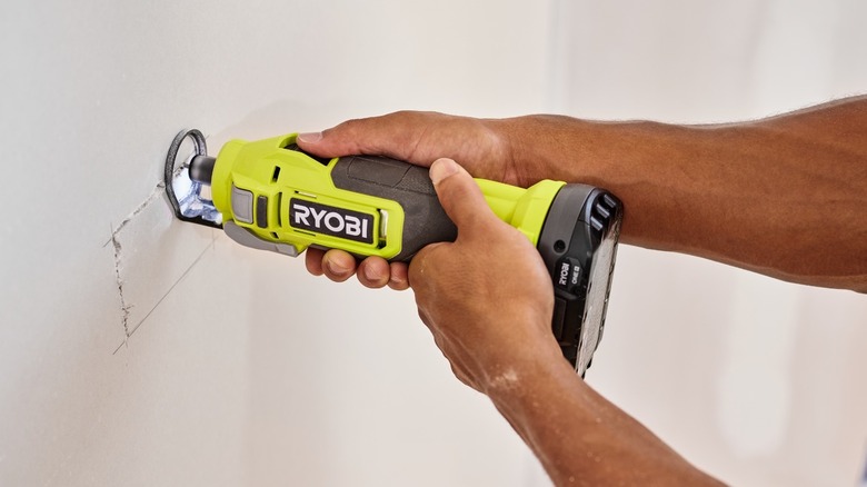 Ryobi cut-out tool cutting wall