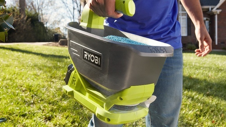 18V ONE+ Seed & Fertiliser Spreader in a garden