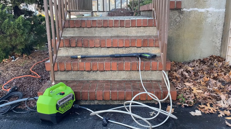 Greenworks pressure washer on steps