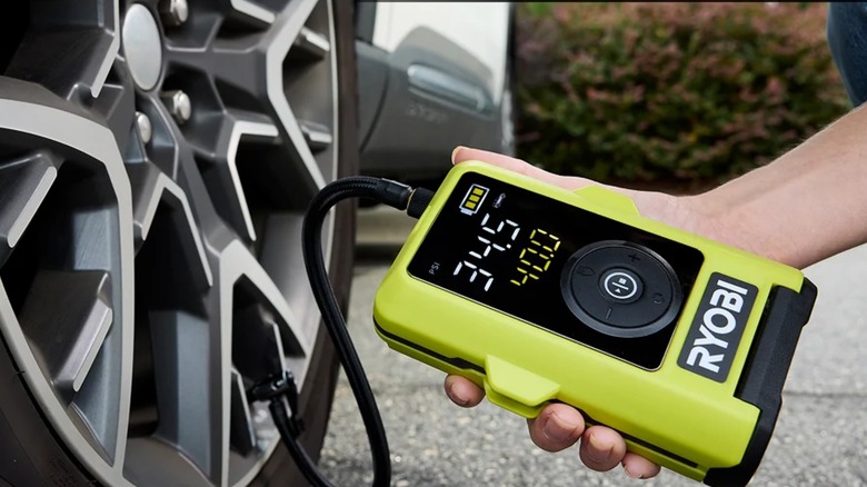 Ryobi inflator next to wheels