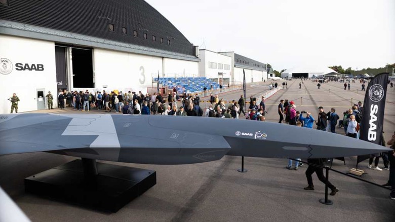 A mockup of the Saab A3-001 Autonomous Collaborative Platform with people standing around