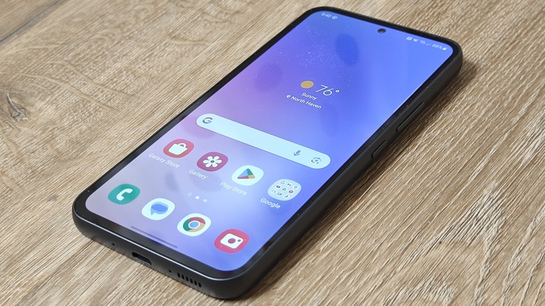 Samsung Galaxy A54 display against a wood background