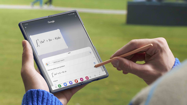 Person using an S Pen with a Samsung Galaxy Z Fold 6