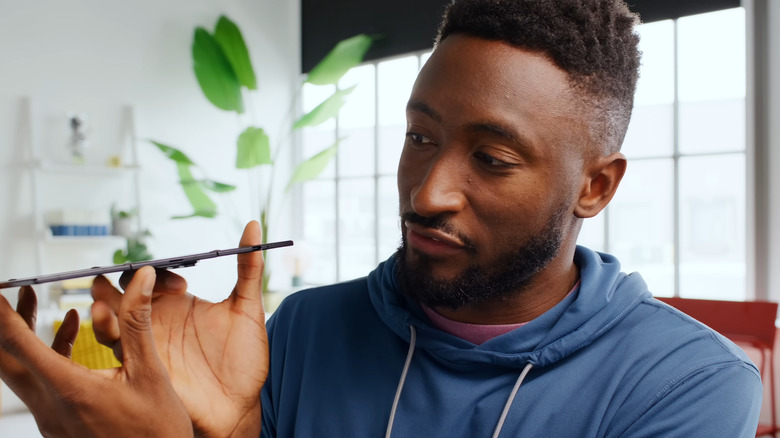 Person holding a fully folded out Samsung Galaxy Z TriFold