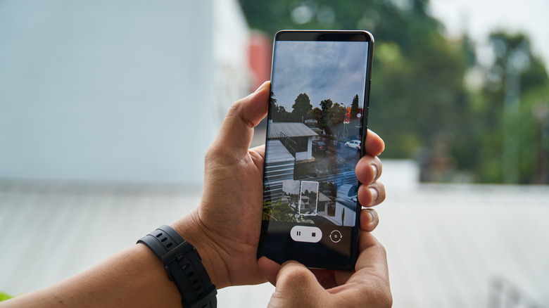 Someone taking photo with Samsung phone