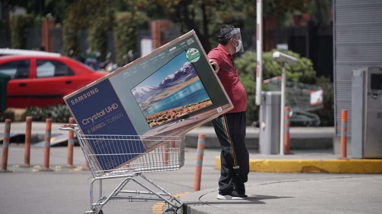 Person with a newly purchased Samsung TV