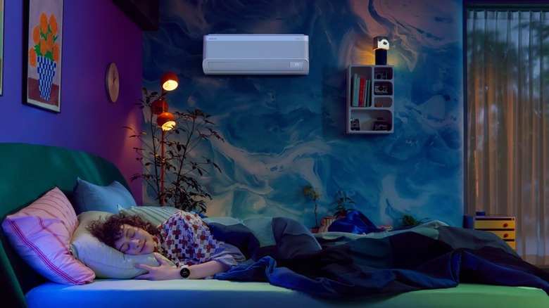 Person sleeping a room with Samsung AC.