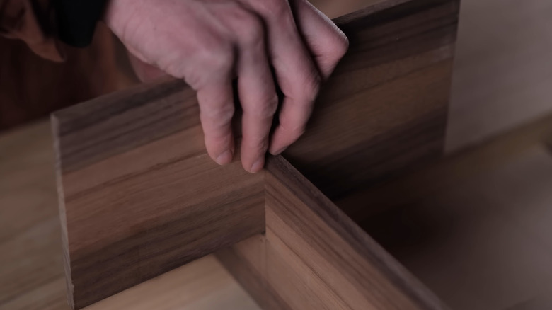 Modern Sashimono worker building cabinet