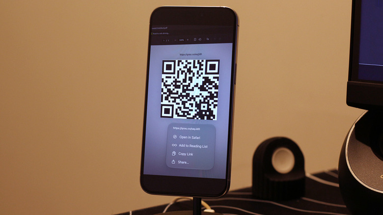 A QR code on an iPhone in the Photos app