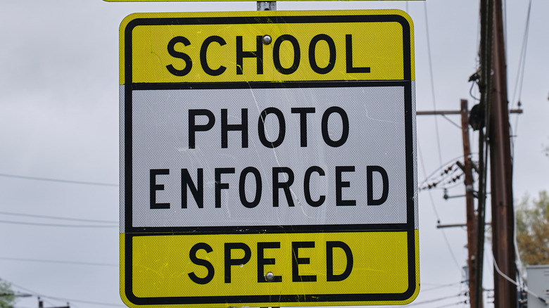 A school zone sign advising drivers that speed is photo enforced