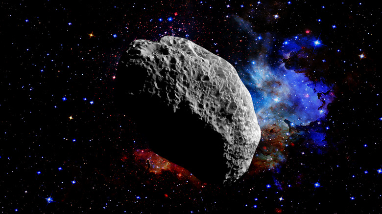 An asteroid floating in space with a starry background.