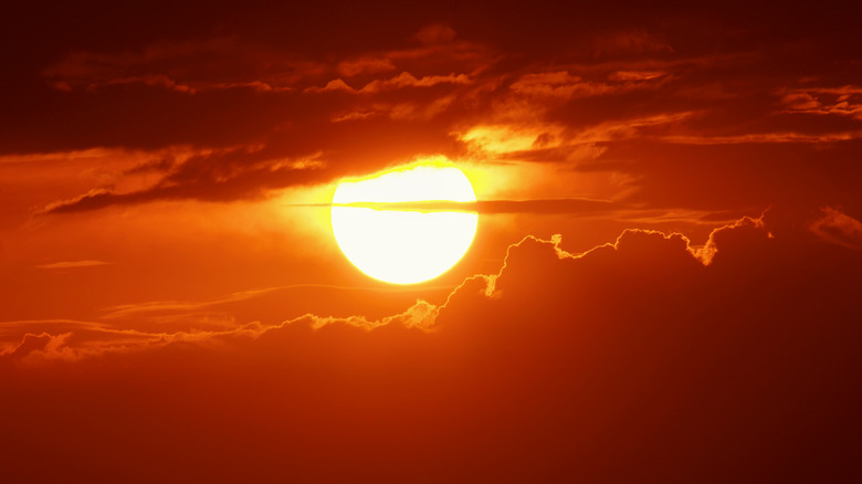 The Sun in cloudy sky