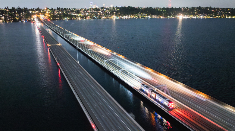 A light rail vehicle crosses the floating bridge under its own power during Crosslake livewire testing