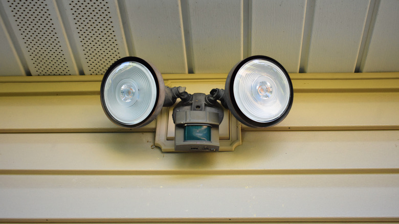 Motion sensor light with two flood lights on a house
