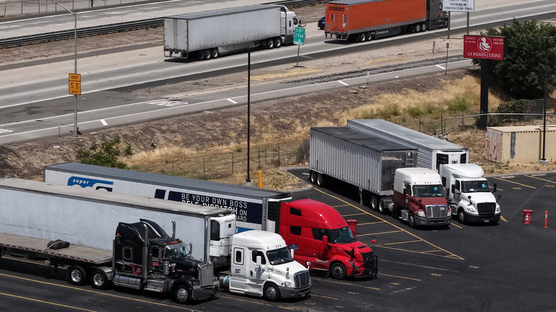 Aerial view of semi trucks parked at truck stop in Southern California.