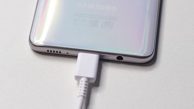 New smartphone Samsung Galaxy A51 close-up of the plug for charging and headphones.