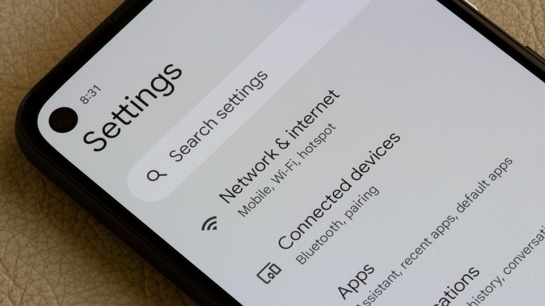 he user interface of the android settings app is seen on a Google Pixel 4a smartphone