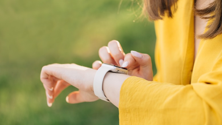 Woman looking at Apple Watch