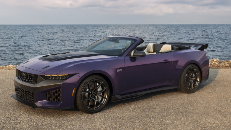 2026 Ford Mustang Dark Horse SC convertible on a road near a water body