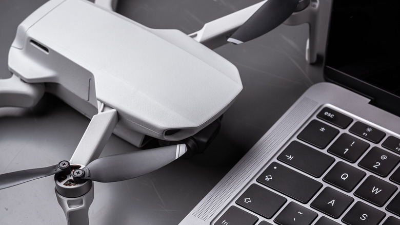 Drone one table next to laptop