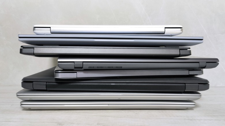 a stack of old laptops