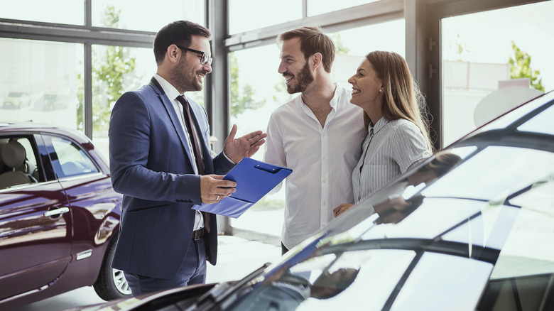 couple buying car