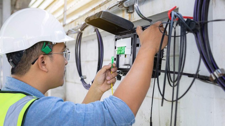 technician repairing internet lines