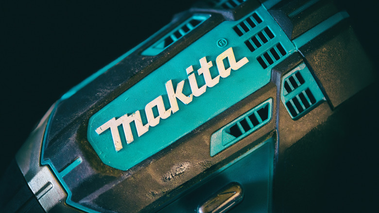 The Makita logo on the side of a drill