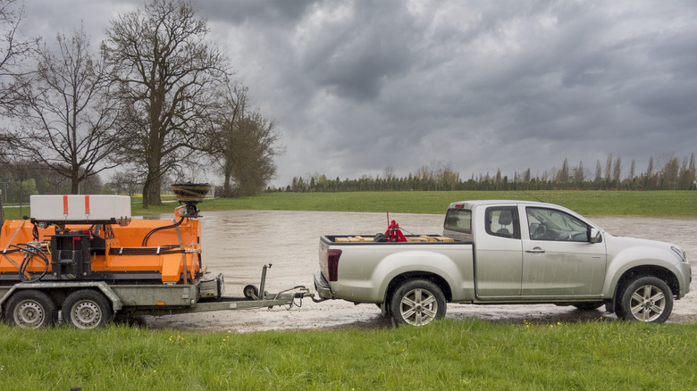 Pickup pulls a trailer near lake
