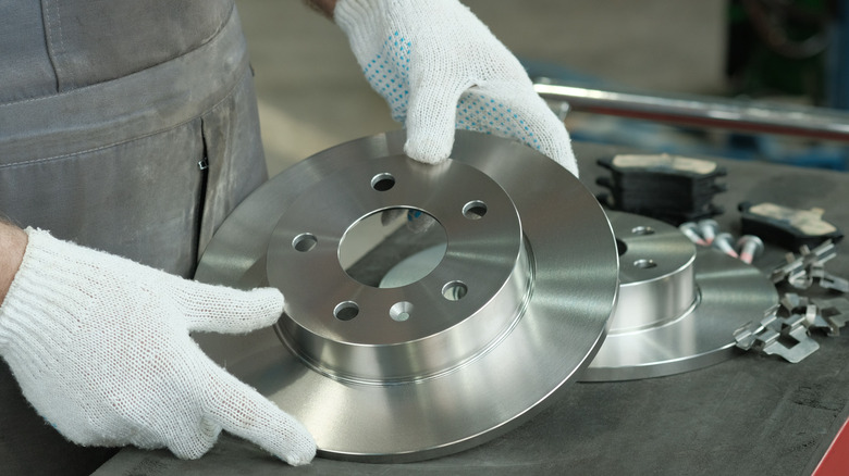 Car brake components being worked on.