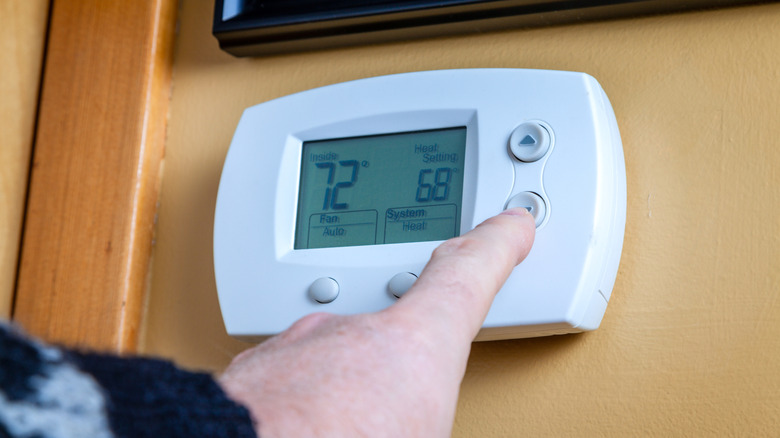 A home thermostat with the fan set to 